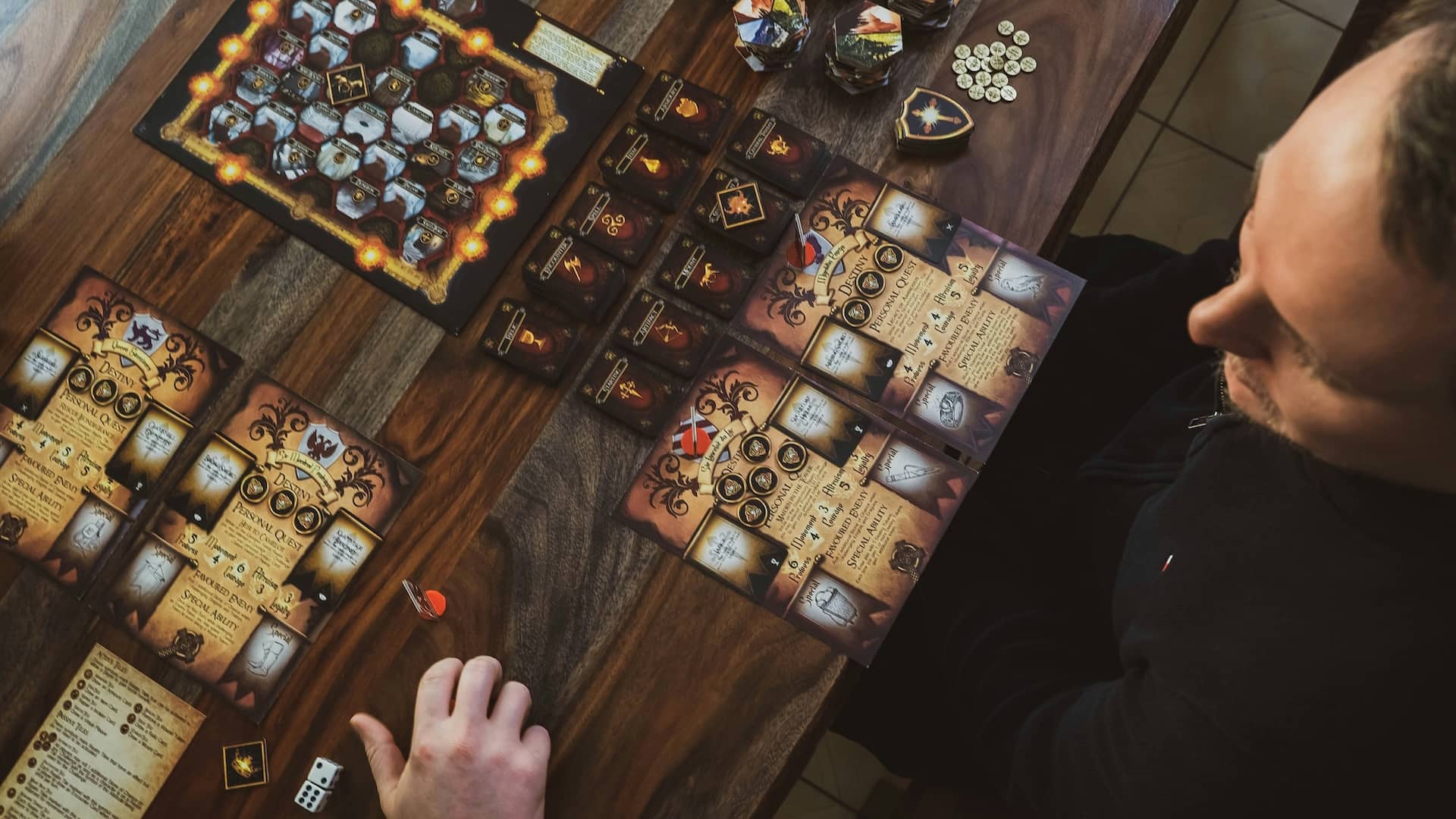Overhead view of a complex board game in progress